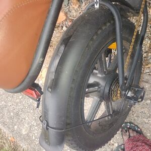 Brown Leather Bicycle Seat with Black Tire